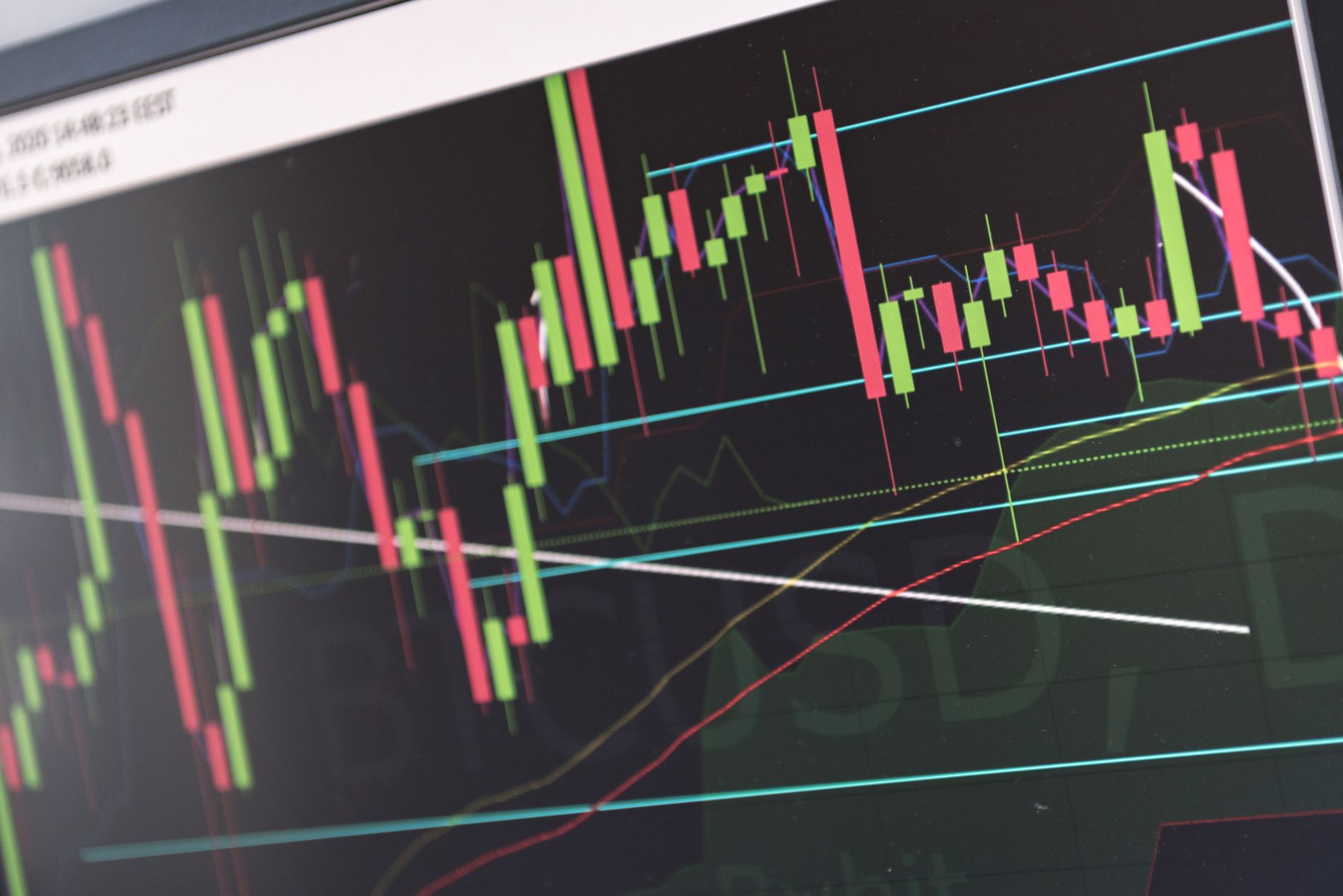 Ilustrasi: Close-up of vibrant stock market graphs displaying trading trends on a monitor, ideal for finance and cryptocurrency concepts.