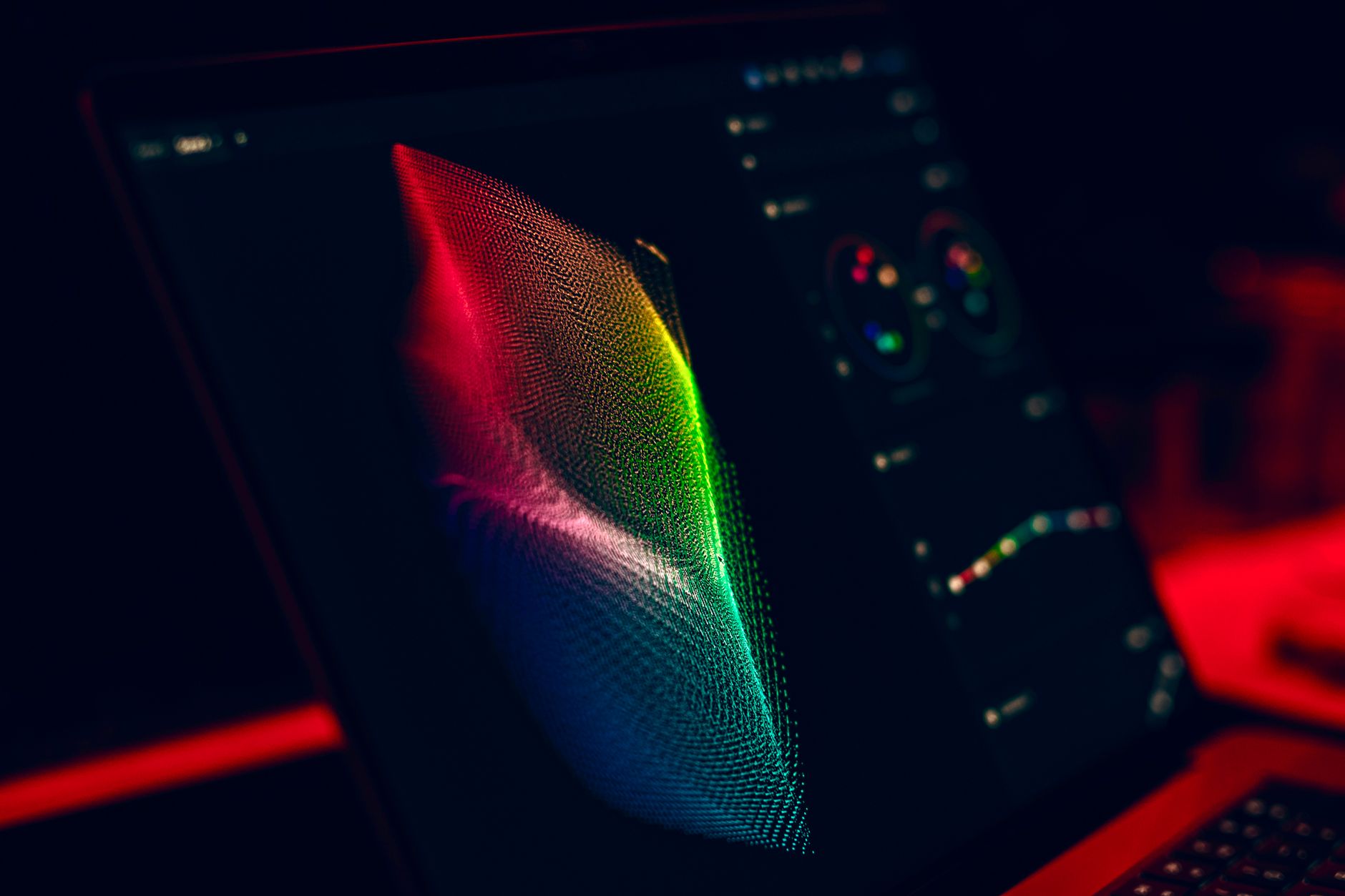 Ilustrasi: Close-up of vibrant digital art in red, green, and blue displayed on a monitor screen.